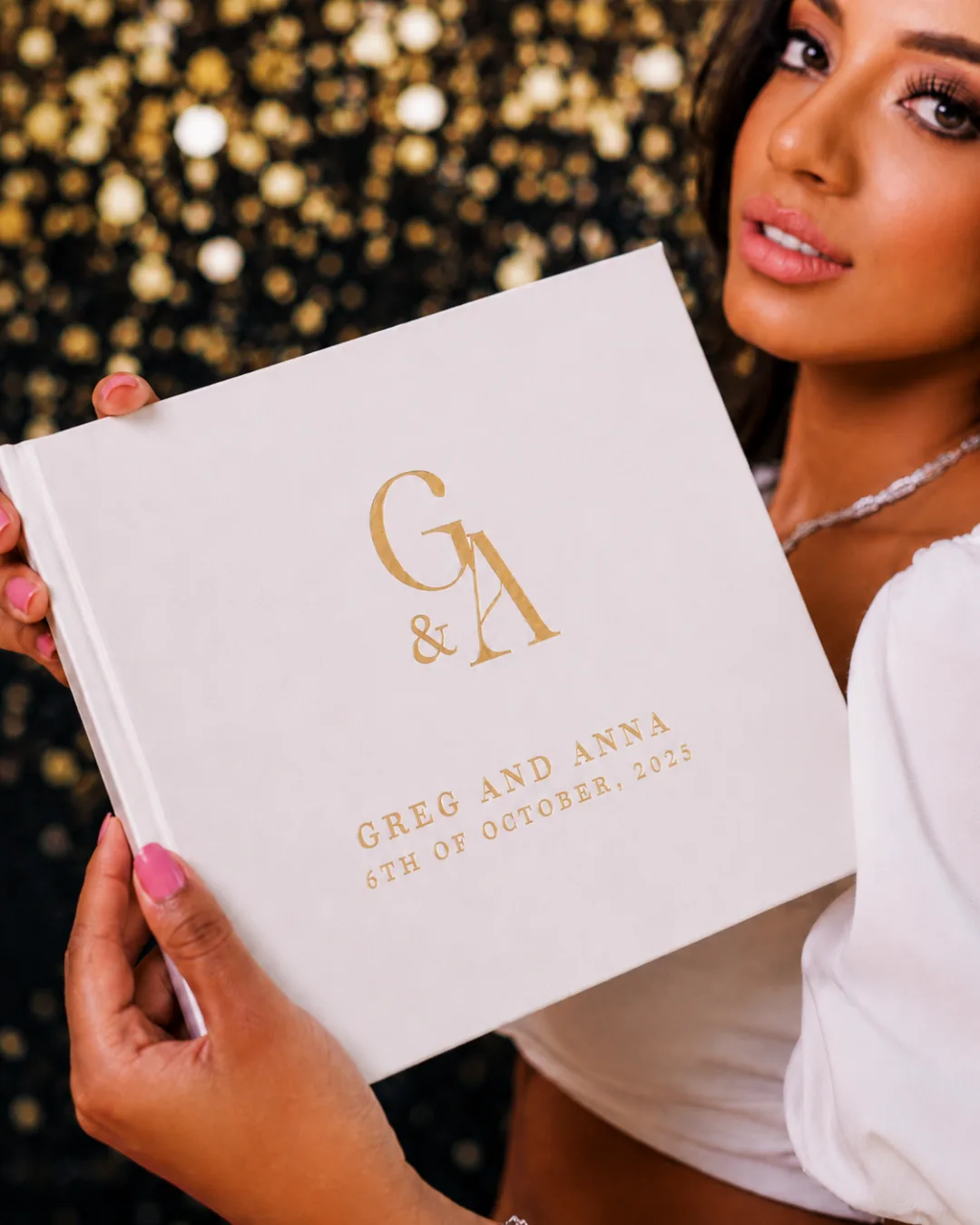 the customised wedding guest book — names and date on the cover